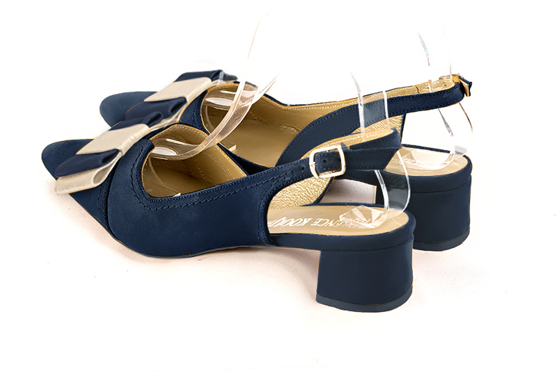 Navy blue and gold women's open back shoes, with a knot. Tapered toe. Low flare heels. Rear view - Florence KOOIJMAN